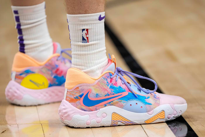 View of Kevin Hueter's pink and blue Nike PG 6 shoes.